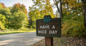 Woodland Estates Aspire Communities Have a Nice Day Sign