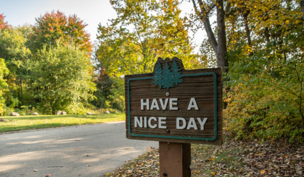Woodland Estates Aspire Communities Have a Nice Day Sign