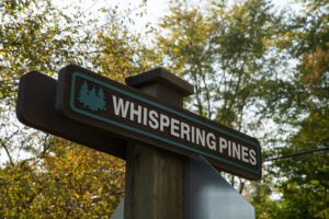 Whispering Pines Aspire Communities Street Sign